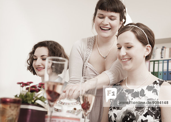 Young women on a retro style tea party