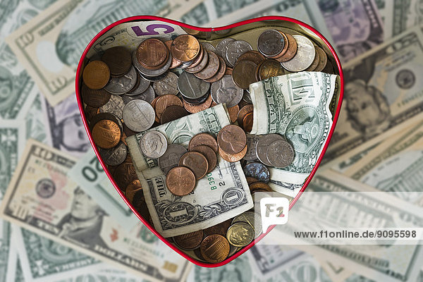 Heart shaped tin box with money