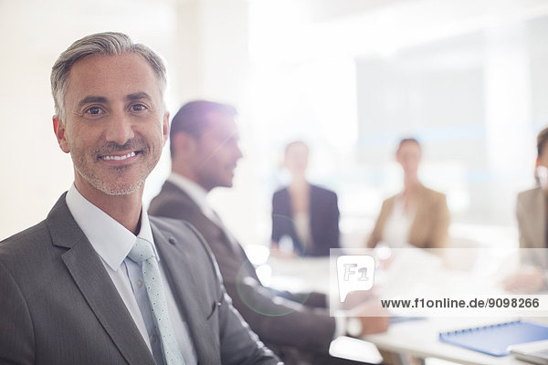 Portrait of confident businessman in conference room