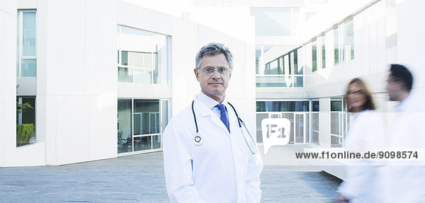 Portrait of confident doctor on rooftop