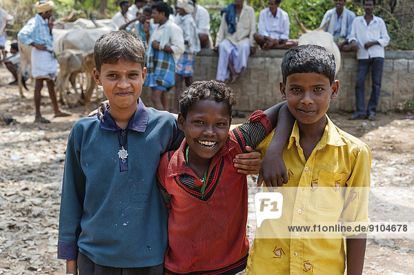 Three smiling Indian children  Begur  Karnataka  India