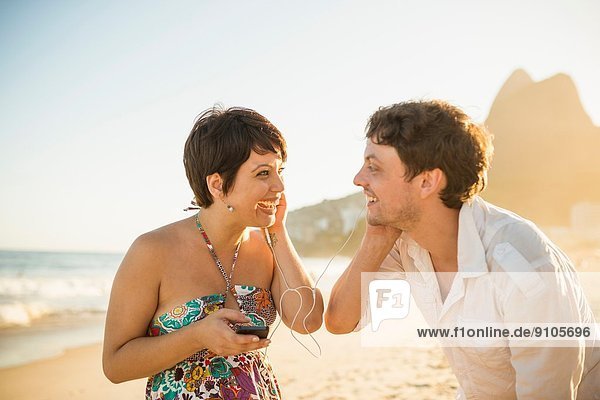 Young couple enjoying sunset  Ipanema Beach  Rio  Brazil