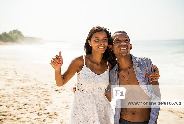 Young couple on Arpoador beach  Rio De Janeiro  Brazil