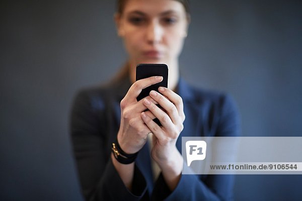 Young woman using smartphone