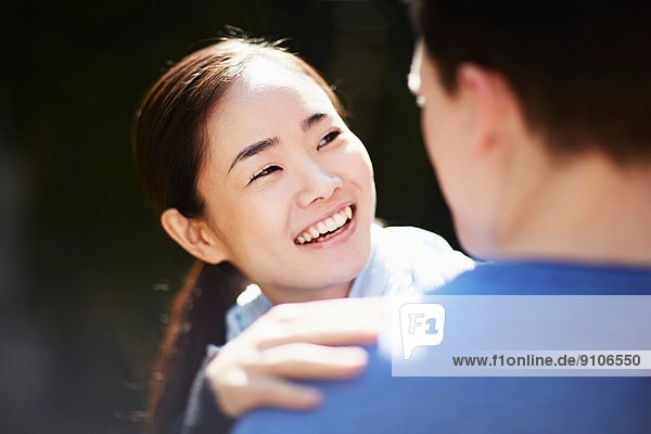 Portrait of young couple woman smiling