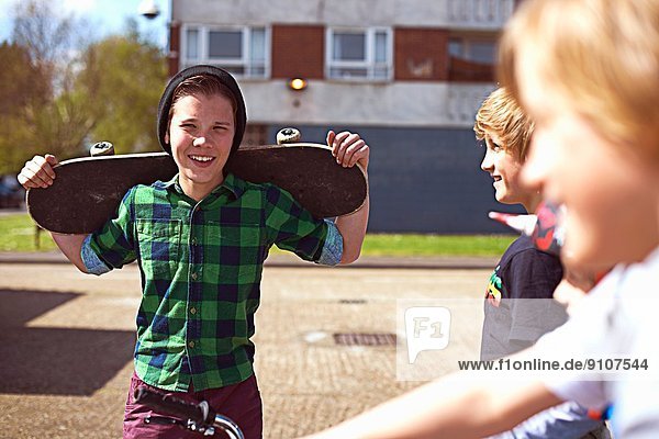 Boy holding skateboard