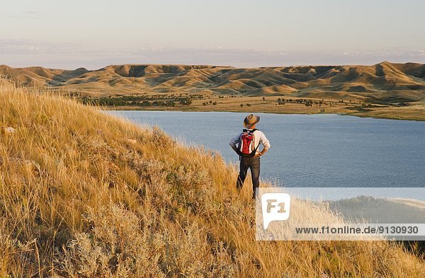 hiker  Saskatchewan Landing Provincial Park with Lake Diefenbaker in the background  Saskatchewan  Canada