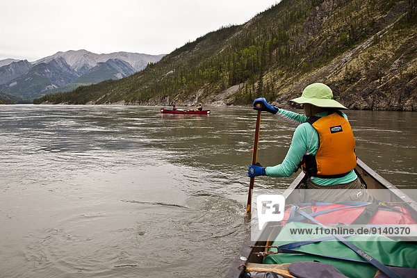 Two canoes on Nahanni River  Nahanni National Park Preserve  NWT  Canada.