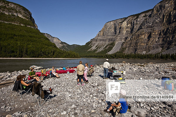 Group of people camped on Nahanni River  Nahanni National Park Preserve  NWT  Canada.