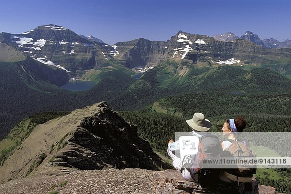 Couple atop Carthew Summit  Carthew-Alderson Trail  Waterton National Park  Alberta  Canada