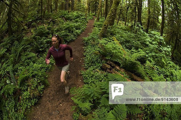 Trail running on the Four Lakes Trail at Alice Lake Provincial Park. Squamish  British Columbia  Canada