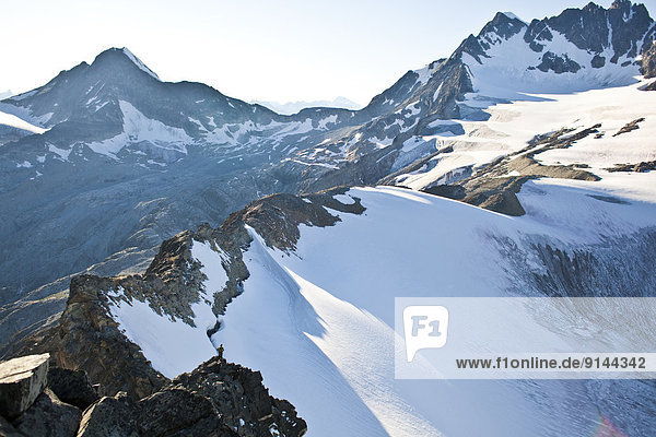 A young man alpine climbing the west ridge of Mt Tupper  Roger's Pass  Glacier National Park  BC