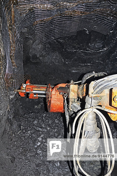 Underground mining drill rig called a 'Jumbo' working at rock face  Eskay Creek mine  Iskut  British Columbia