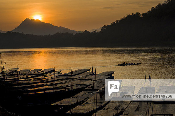 The sun sets over the Mekong River in Luang Probang  Laos