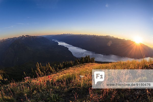 Sunset over the Valhalla Range and Slocan lake from Idaho Peak.