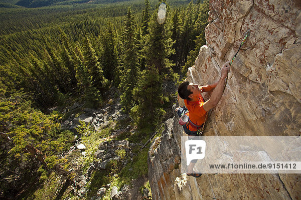 A strong male climber climbing  RUDED2 10d  Silver City  Castle Mtn  Banff  AB