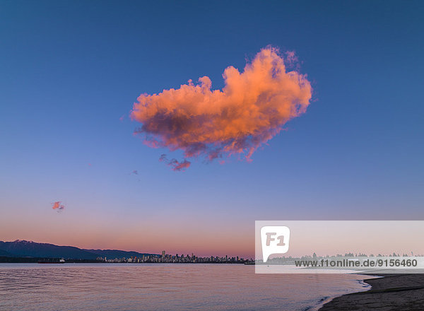 solitary cloud at sunset over Jericho Beach  Vancouver  British Columbia  Canada