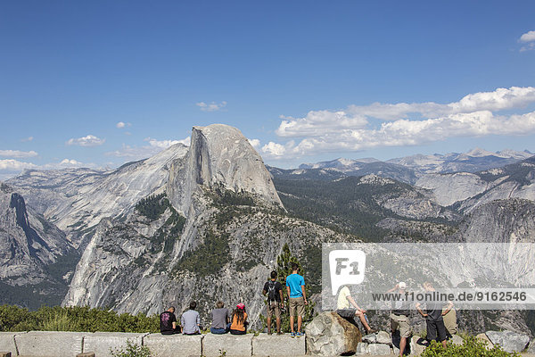 Visitors in front of the Half Dome  Yosemite National Park  California  United States