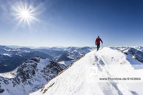 Climbers during the ascent to the Penser Weißhorn from Penser Joch in the Sarn Valley in the Sarn Alps  here on the summit ridge  Province of South Tyrol  Italy