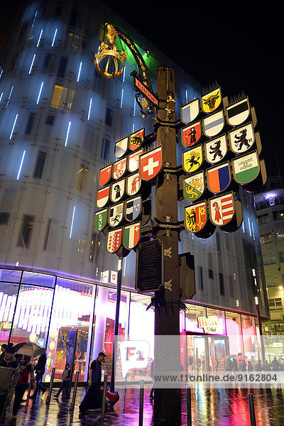 Swiss cantonal coats of arms on Leicester Square  at night  London  England  United Kingdom