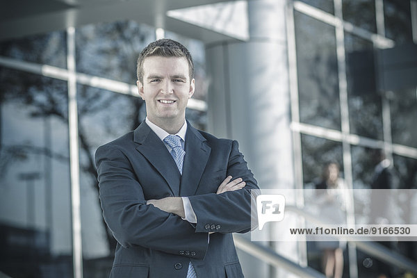 Businessman smiling outdoors