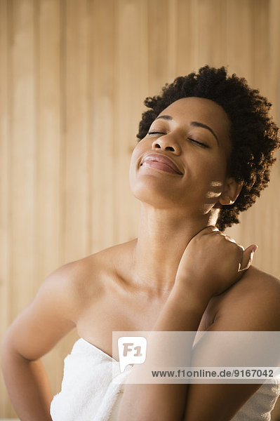 Serene Black woman wrapped in a towel