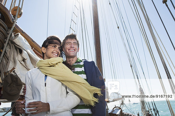 Caucasian couple on sailboat