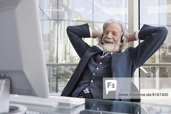 Senior Caucasian businessman talking on headset