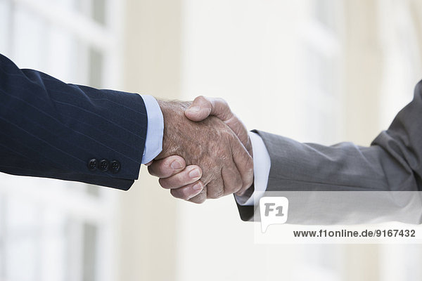 Caucasian businessmen shaking hands