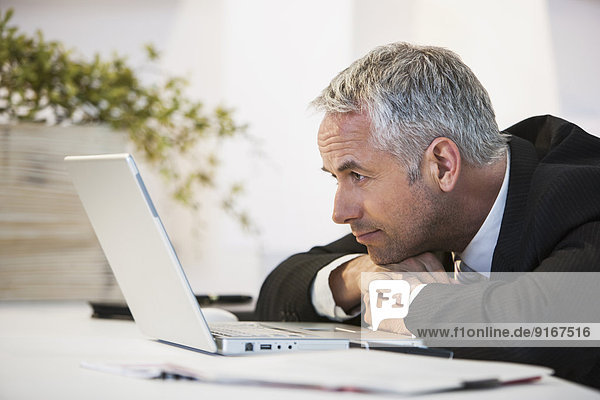 Businessman working at desk in office