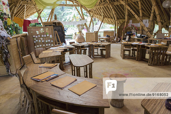 Circular desks in bamboo classroom