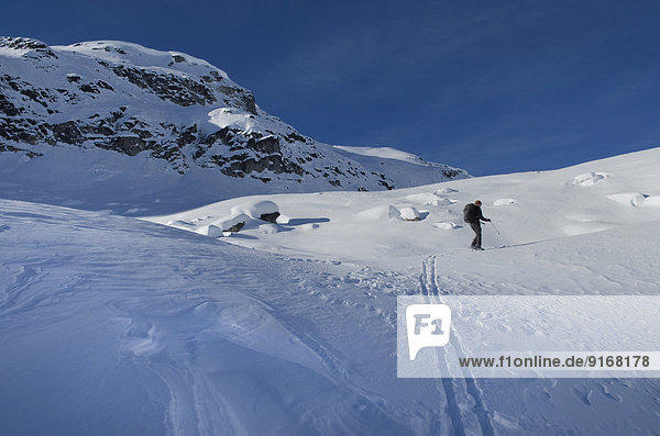 Caucasian skier in snowy landscape