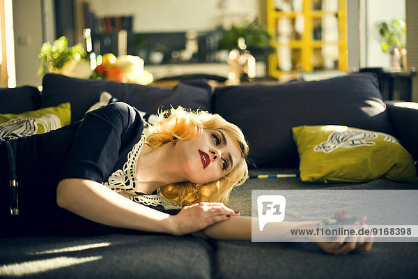 Caucasian woman relaxing on sofa