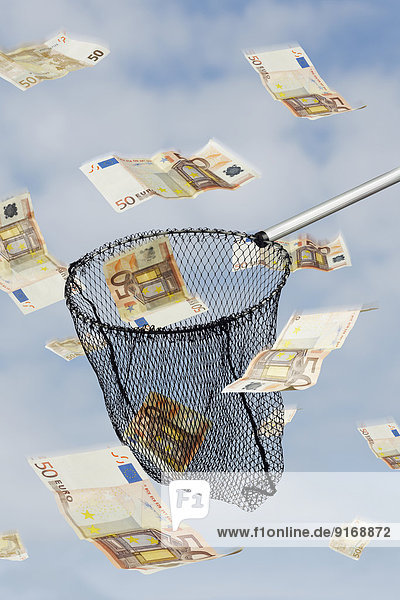 Fishing net catching Euro notes