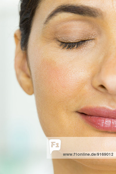 Close up of mixed race woman's face