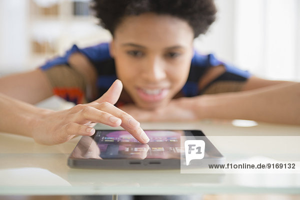 Black woman using digital tablet