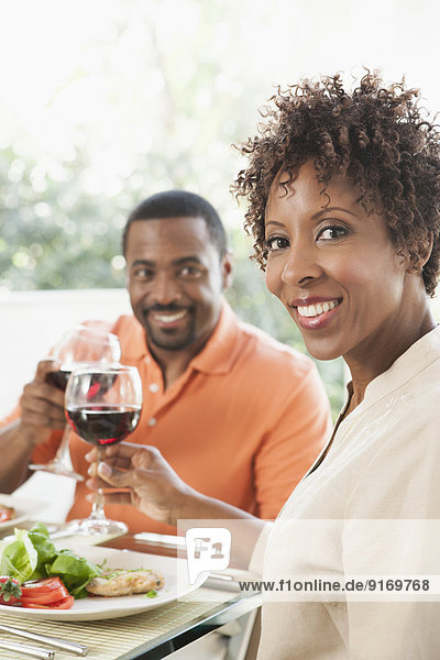 African American couple eating together