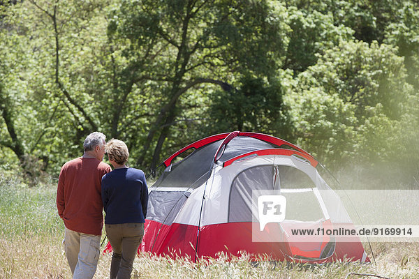 Senior Caucasian couple admiring campsite