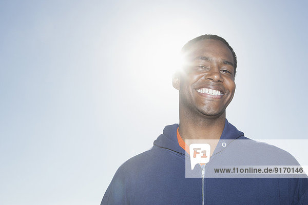 Mixed race man smiling outdoors