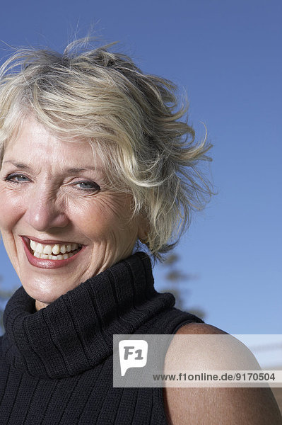 Senior Caucasian woman smiling outdoors