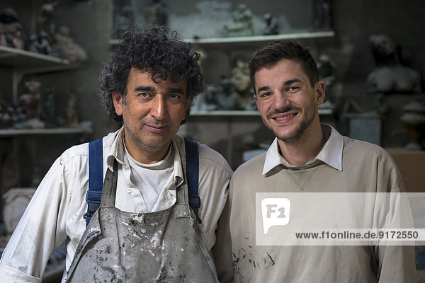 Gremany  Munich  Portrait of two art foundry workers
