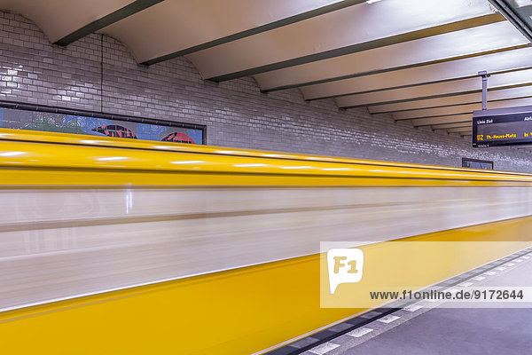 Germany  Berlin  subway station Deutsche Oper with moving underground train