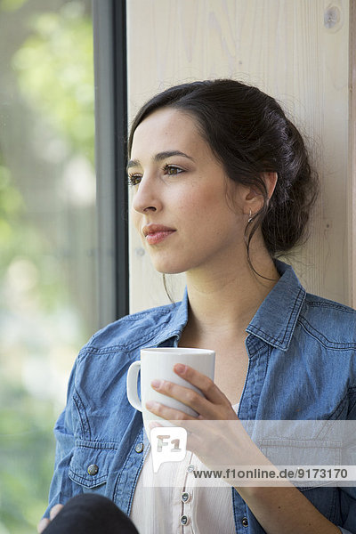 Portrait of creative business woman having coffee break