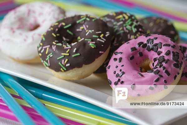 Plate of decorated doughnuts  close-up