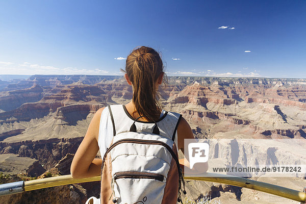 USA  Arizona  young woman enjoying the view at Grand Canyon  back view