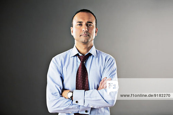 Portrait of confident businessman with arms crossed