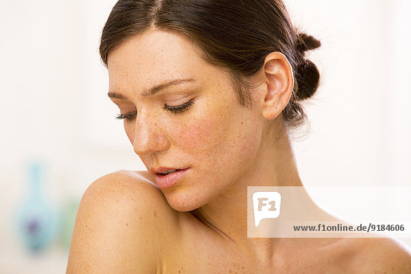 Caucasian woman looking over her shoulder