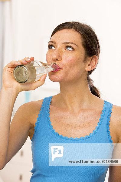 Caucasian woman drinking water