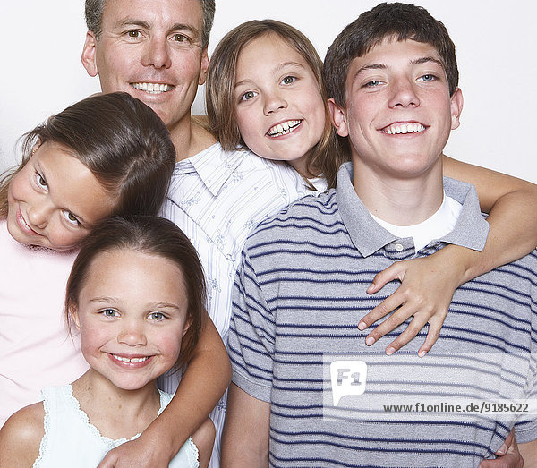 Father and children smiling together