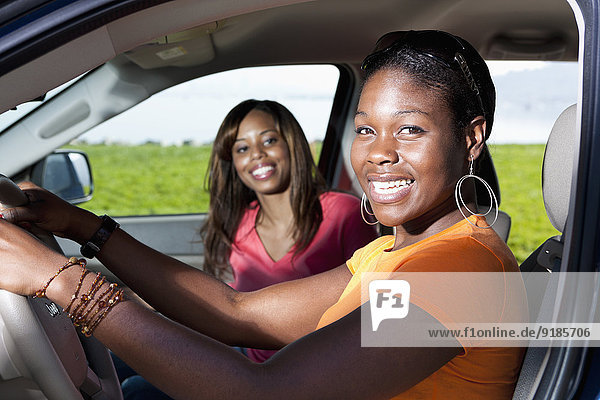 African American women driving together